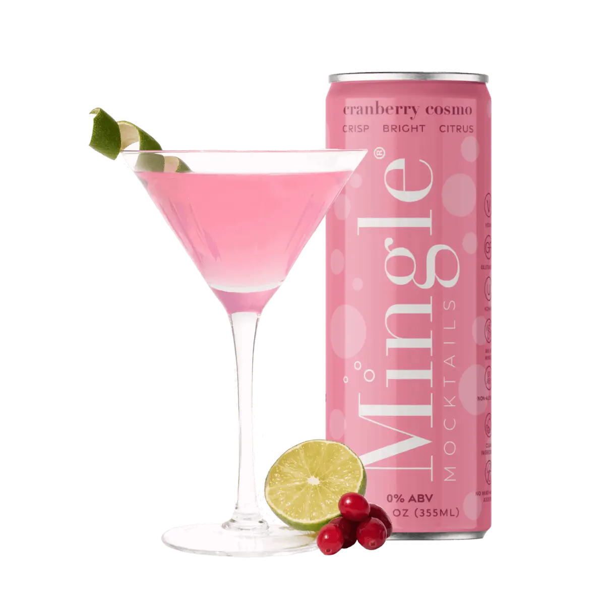 Mingle Mocktails Cranberry Cosmo can next to a pink cocktail in a martini glass, garnished with a twisted lime wedge. Fresh cranberries and a sliced lime are placed at the base of the glass. The can is a bright pink with white text highlighting 