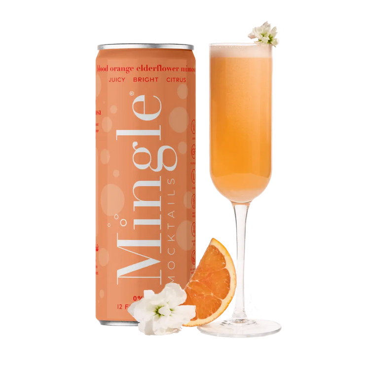 A vibrant Blood Orange Elderflower Mimosa mocktail served in a champagne flute, garnished with fresh orange and elderflower, paired with a can of Mingle Mocktails for a sophisticated experience.