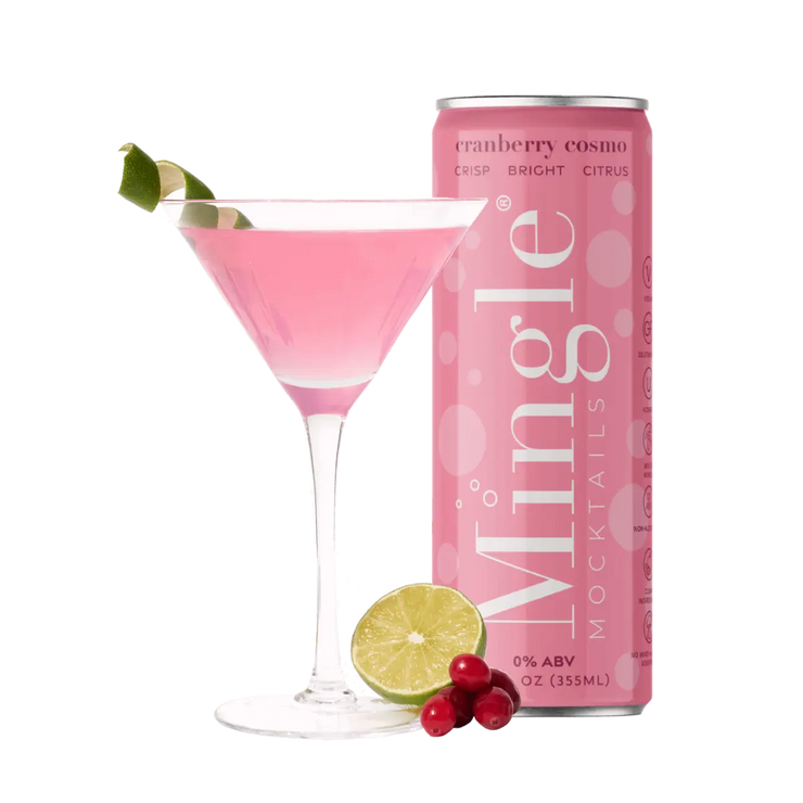 A vibrant Cranberry Cosmo mocktail served in a cocktail glass, garnished with lime and cranberries, paired with a can of Mingle Mocktails for a festive experience.