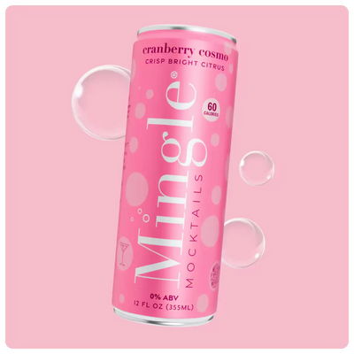 cranberry cosmo mocktail can in bright pink packaging with bubbles on a matching pink background